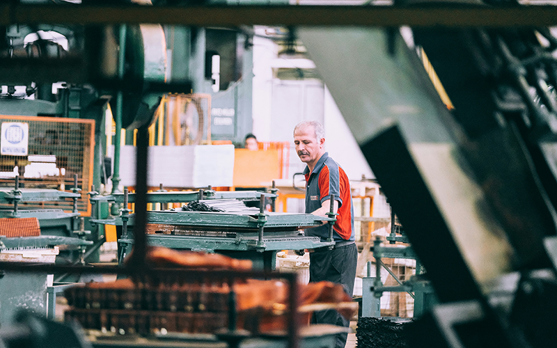 employee using machinery needing ocupational health services